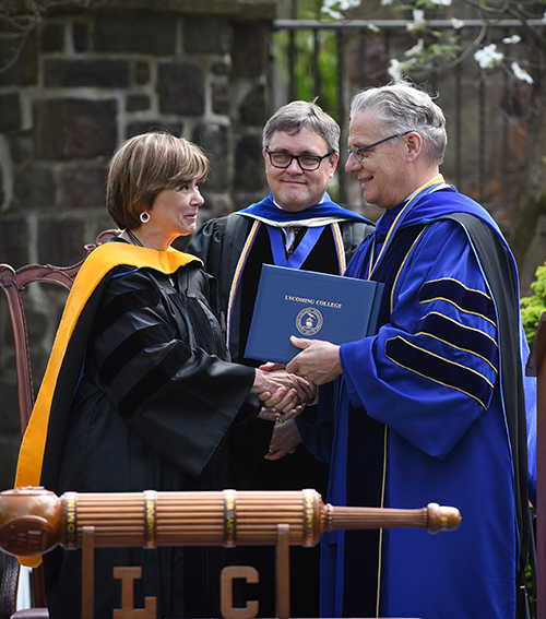 President Trachte confers an honorary degree to Dr. Marina Nikki Vernalis '73.